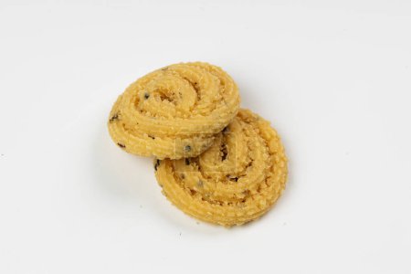 Photo for MURUKKU, Kerala  special snack made using rice flour, isolated image arranged in white background. - Royalty Free Image