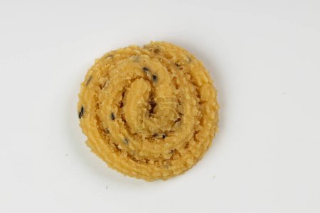 MURUKKU, Kerala  special snack made using rice flour, isolated image arranged in white background.