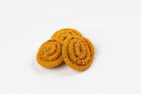 MURUKKU, Kerala  special snack made using rice flour, isolated image arranged in white background.