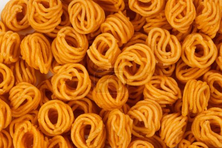 Photo for MURUKKU, Small spiral murukku which is very spicy and tasty, isolated images with white background. - Royalty Free Image