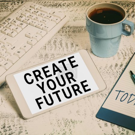 Photo for Sign displaying Create Your Future, Business concept Know what you want and willingness to do to achieve Important Idea Shown On Phone On Desk With Cup With Pencils And Books. - Royalty Free Image
