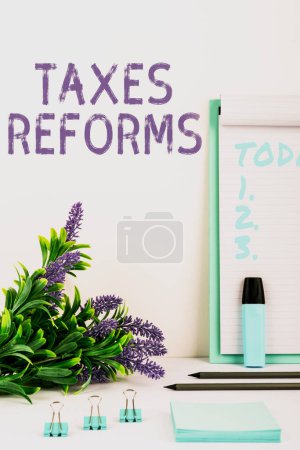 Photo for Text showing inspiration Taxes Reforms, Conceptual photo managing collected taxes in a more efficient process - Royalty Free Image