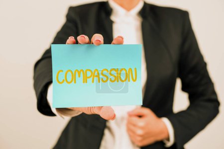 Writing displaying text Compassion, Business overview empathy and concern for the pain or misfortune of others Businesswoman Holding Note With Important Message With One Hand.
