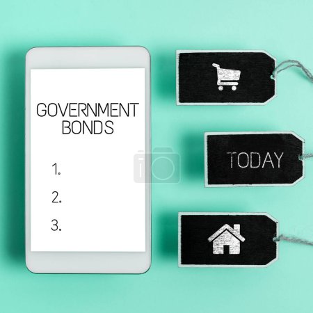 Photo for Inspiration showing sign Government Bonds, Concept meaning reverse the effects of human activity on the environment Tablet With Important Message Over Clipboard And Piece Of Paper. - Royalty Free Image