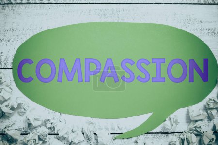 Photo for Text caption presenting Compassion, Internet Concept empathy and concern for the pain or misfortune of others Notebook With New Idea On Desk With Pens, Sharpener, Marker And Cellphone. - Royalty Free Image