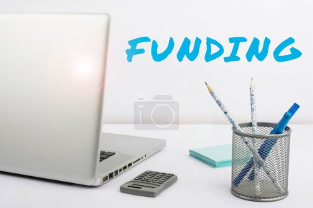 Photo for Writing displaying text Funding, Concept meaning act of providing resources to finance a need, program, or project - Royalty Free Image