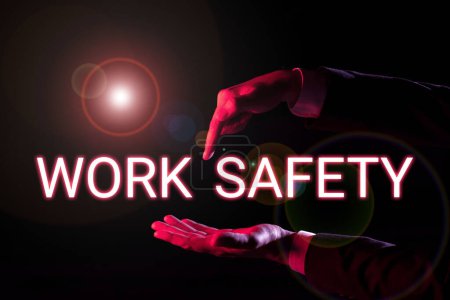 Téléchargez les photos : Texte manuscrit Sécurité au travail, Idée d'entreprise mesures préventives appliquées par les entreprises pour protéger la santé des travailleurs - en image libre de droit