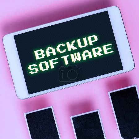Photo for Writing displaying text Backup Software, Word Written on create extra exact copies of files or entire computers - Royalty Free Image