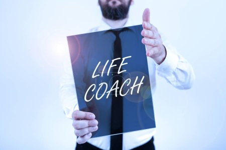Photo for Writing displaying text Life Coach, Internet Concept A person who advices clients how to solve their problems or goals - Royalty Free Image