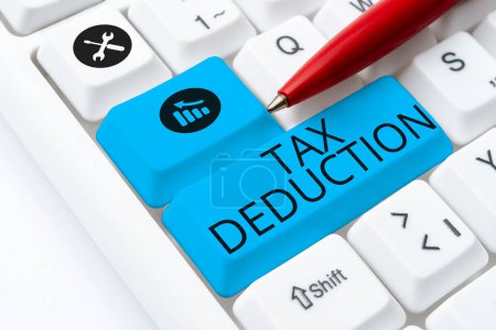 Photo for Text sign showing Tax Deduction, Word Written on amount subtracted from income before calculating tax owe - Royalty Free Image