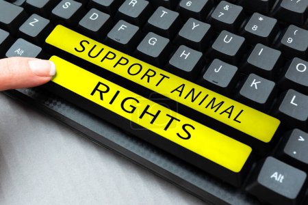 Foto de Expositor conceptual Apoyo a los derechos de los animales, protección de las ideas empresariales y tratamiento adecuado de todos los animales - Imagen libre de derechos