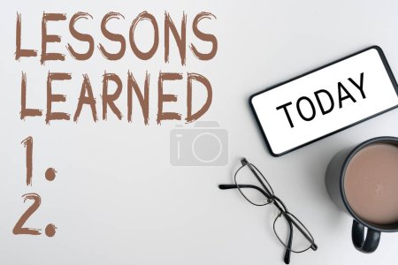 Photo for Inspiration showing sign Lessons Learned, Business overview Promote share and use knowledge derived from experience - Royalty Free Image