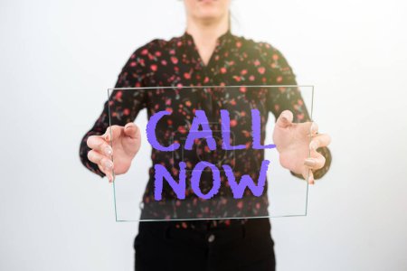 Photo for Sign displaying Call Now, Word Written on To immediately contact a person using telecom devices with accuracy - Royalty Free Image