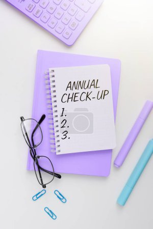 Photo for Writing displaying text Annual Check Up, Concept meaning yearly evaluation and examination of persons health status - Royalty Free Image