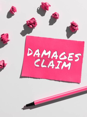 Photo for Handwriting text Damages Claim, Business idea Demand Compensation Litigate Insurance File Suit - Royalty Free Image