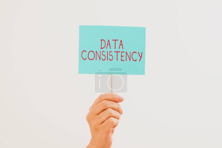 Photo for Sign displaying Data Consistency, Word Written on data values are the same for all instances of application - Royalty Free Image