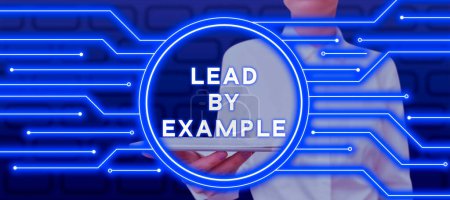 Photo for Inspiration showing sign Lead By Example, Word for Be a mentor leader follow the rules give examples Coach - Royalty Free Image