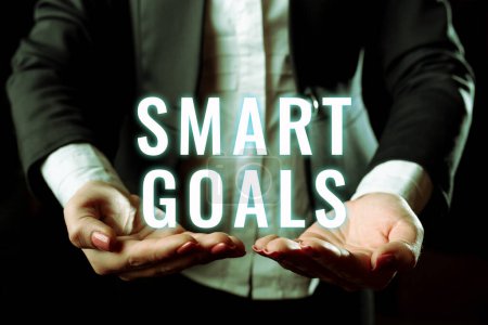 Photo for Sign displaying Smart Goals, Word Written on mnemonic used as a basis for setting objectives and direction - Royalty Free Image