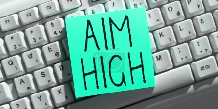 Photo for Hand writing sign Aim High, Word for go for best job school or activity Asking someone to dream big - Royalty Free Image