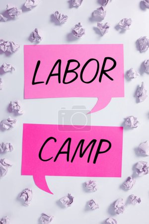 Photo for Conceptual caption Labor Camp, Word Written on a penal colony where forced labor is performed - Royalty Free Image