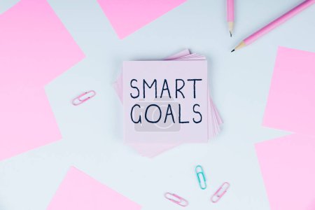 Photo for Hand writing sign Smart Goals, Business overview mnemonic used as a basis for setting objectives and direction - Royalty Free Image