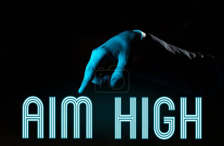 Photo for Inspiration showing sign Aim High, Internet Concept go for best job school or activity Asking someone to dream big - Royalty Free Image