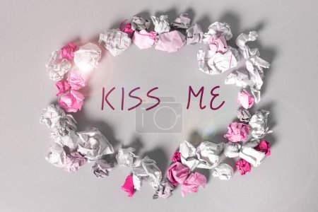 Photo for Text sign showing Kiss Me, Word Written on informally request to touch my lips with your lips or press against - Royalty Free Image