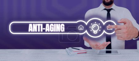 Téléchargez les photos : Légende conceptuelle Anti Aging, Concept signifiant Un produit conçu pour empêcher l'apparition de vieillir - en image libre de droit