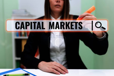 Photo for Hand writing sign Capital Markets, Word Written on Allow businesses to raise funds by providing market security - Royalty Free Image