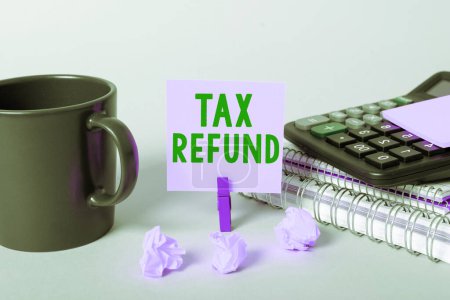 Photo for Text caption presenting Tax Refund, Business approach applied when money liability is less than the paid ones - Royalty Free Image