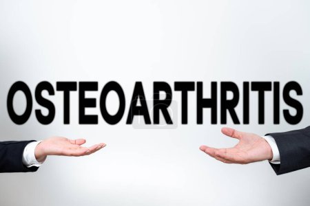 Foto de Texto de la escritura Osteoartritis, Palabra escrita en Degeneración del cartílago articular y el hueso subyacente - Imagen libre de derechos