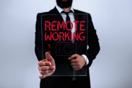 Photo for Text sign showing Remote Working, Internet Concept situation in which an employee works mainly from home - Royalty Free Image