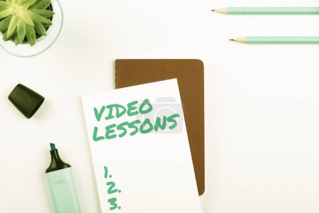 Foto de Text showing inspiration Video Lessons, Word Written on Online Education material for a topic Viewing and learning - Imagen libre de derechos