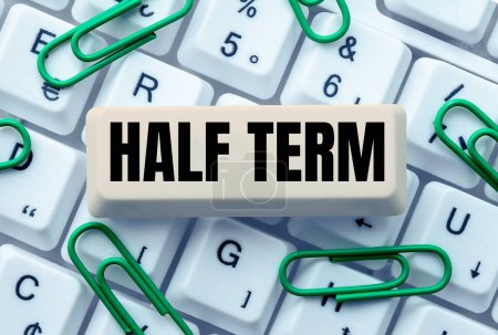 Photo for Hand writing sign Half Term, Conceptual photo half the usual price at which something is offered for sale - Royalty Free Image