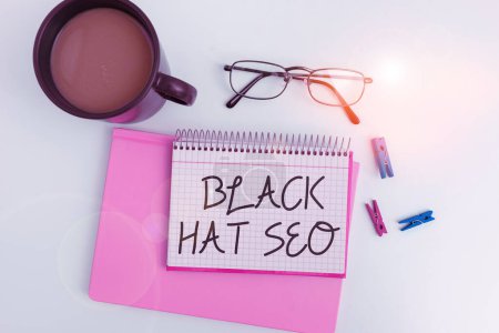 Téléchargez les photos : Sign displaying Black Hat Seo, Concept meaning Search Engine Optimization using techniques to cheat browsers - en image libre de droit
