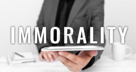 Photo for Text sign showing Immorality, Business idea the state or quality of being immoral, wickedness - Royalty Free Image
