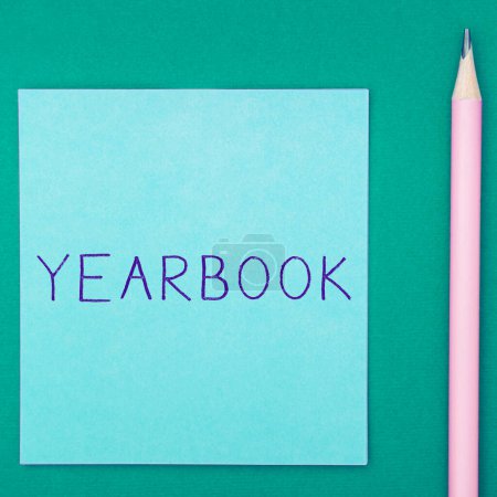 Photo for Sign displaying Yearbook, Word for publication compiled by graduating class as a record of the years activities - Royalty Free Image