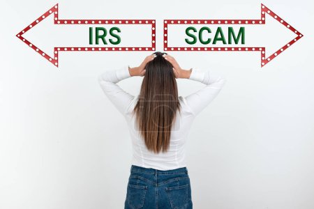 Téléchargez les photos : Sign displaying Irs Scam, Business approach targeted taxpayers by pretending to be Internal Revenue Service - en image libre de droit