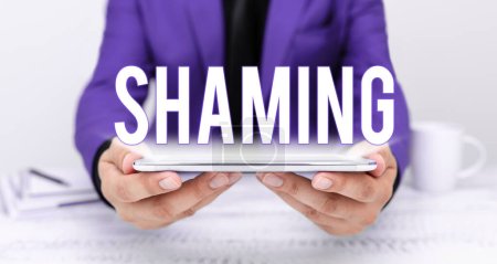 Photo for Text showing inspiration Shaming, Word Written on subjecting someone to disgrace, humiliation, or disrepute by public exposure - Royalty Free Image