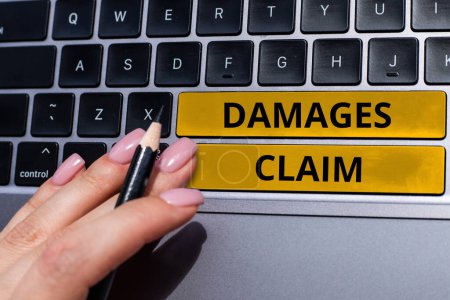 Téléchargez les photos : Hand writing sign Damages Claim, Business approach Demand Compensation Litigate Insurance File Suit - en image libre de droit