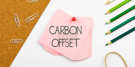 Photo for Text sign showing Carbon Offset, Business approach Reduction in emissions of carbon dioxide or other gases - Royalty Free Image