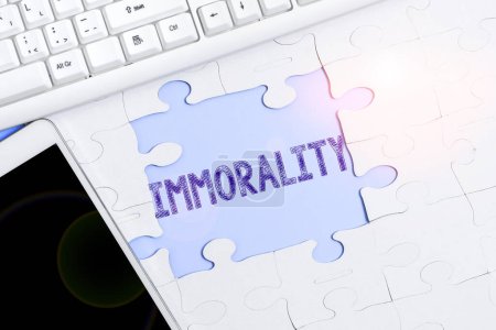 Photo for Text sign showing Immorality, Conceptual photo the state or quality of being immoral, wickedness - Royalty Free Image
