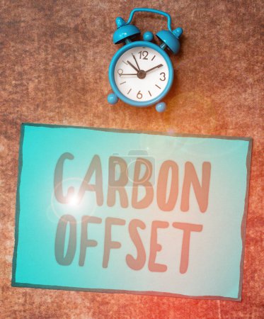 Photo for Text sign showing Carbon Offset, Word Written on Reduction in emissions of carbon dioxide or other gases - Royalty Free Image