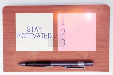 Photo for Handwriting text Stay Motivated, Word for Reward yourself every time you reach a goal with knowledge - Royalty Free Image
