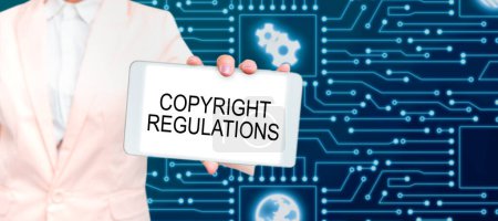 Foto de Text sign showing Copyright Regulations, Word for body of law that governs the original works of authorship - Imagen libre de derechos
