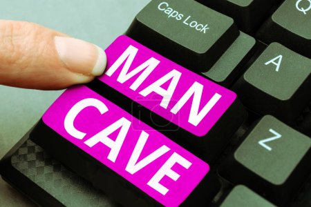 Foto de Texto que presenta Man Cave, idea de negocio una habitación, espacio o área de una vivienda reservada para una persona masculina - Imagen libre de derechos