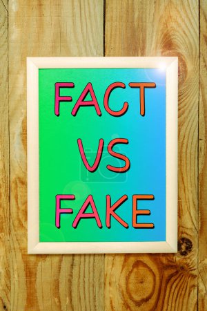 Photo for Sign displaying Fact Vs Fake, Word Written on Is it true or is false doubt if something is real authentic - Royalty Free Image