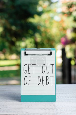 Photo for Sign displaying Get Out Of Debt, Word for No prospect of being paid any more and free from debt - Royalty Free Image