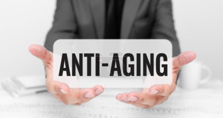 Hand writing sign Anti Aging, Word Written on A product designed to prevent the appearance of getting older