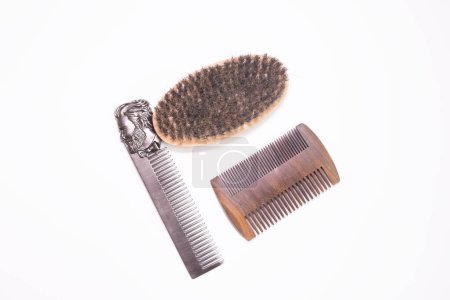 Foto de Different combs, brushes and other tools for grooming a beard. Close up view. - Imagen libre de derechos